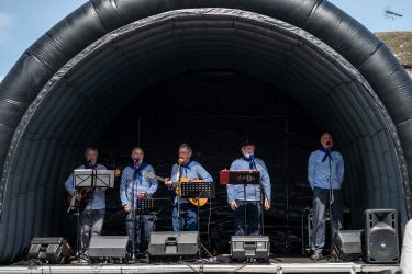 A photo of some musicians at the taste of the sea festival.