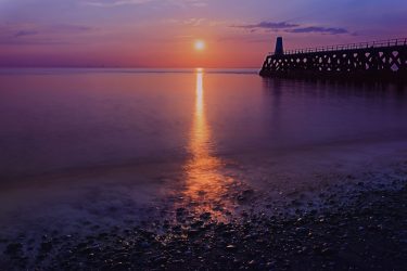 Photo of the beach at maryport at dusk